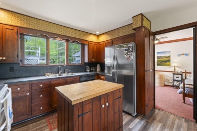 Located at the end of Belgrade Lakes Village, 14 Lakeshore Drive on Belgrade Lakes Golf Club in Maine - for sale on GolfHomes.com, golf home, golf lot