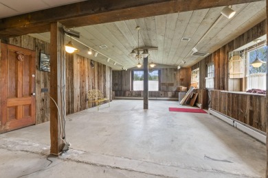 Located at the end of Belgrade Lakes Village, 14 Lakeshore Drive on Belgrade Lakes Golf Club in Maine - for sale on GolfHomes.com, golf home, golf lot
