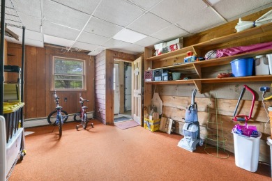 Located at the end of Belgrade Lakes Village, 14 Lakeshore Drive on Belgrade Lakes Golf Club in Maine - for sale on GolfHomes.com, golf home, golf lot