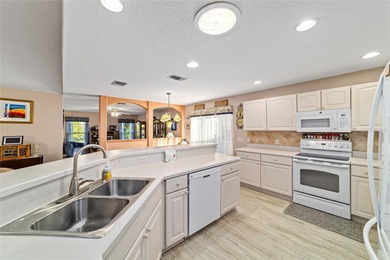 Located in SummerGlen, Ocala, this 2-bedroom, 2-bath home spans on Summerglen Country Club in Florida - for sale on GolfHomes.com, golf home, golf lot