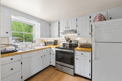 Located at the end of Belgrade Lakes Village, 14 Lakeshore Drive on Belgrade Lakes Golf Club in Maine - for sale on GolfHomes.com, golf home, golf lot