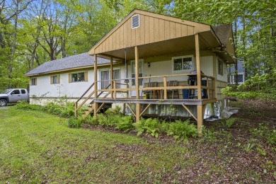 Located at the end of Belgrade Lakes Village, 14 Lakeshore Drive on Belgrade Lakes Golf Club in Maine - for sale on GolfHomes.com, golf home, golf lot