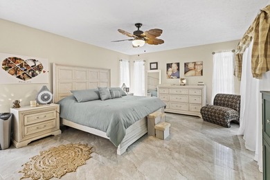 Nestled on a serene culdesac, this beautifully updated home on St. Lucie Trail Golf Club in Florida - for sale on GolfHomes.com, golf home, golf lot