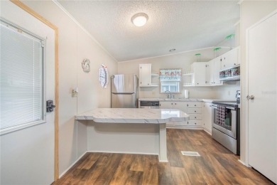 Welcome to effortless living in this charming 2-bedroom, 2-bath on Sweetwater Golf and Tennis Club in Florida - for sale on GolfHomes.com, golf home, golf lot