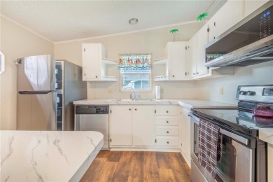 Welcome to effortless living in this charming 2-bedroom, 2-bath on Sweetwater Golf and Tennis Club in Florida - for sale on GolfHomes.com, golf home, golf lot