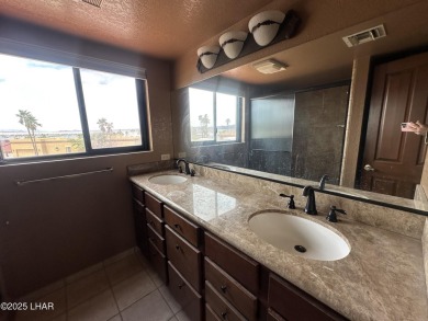 Investor special with incredible lake, mountain, and golf course on London Bridge Golf Course in Arizona - for sale on GolfHomes.com, golf home, golf lot