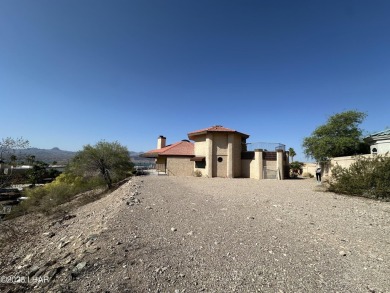 Investor special with incredible lake, mountain, and golf course on London Bridge Golf Course in Arizona - for sale on GolfHomes.com, golf home, golf lot