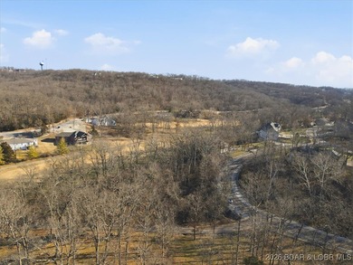 Nestled in the heart of the Village of Four Seasons, this on Seasons Ridge At Four Seasons in Missouri - for sale on GolfHomes.com, golf home, golf lot