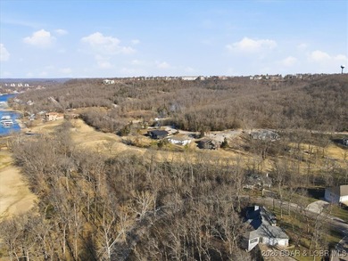 Nestled in the heart of the Village of Four Seasons, this on Seasons Ridge At Four Seasons in Missouri - for sale on GolfHomes.com, golf home, golf lot