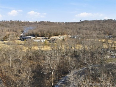 Nestled in the heart of the Village of Four Seasons, this on Seasons Ridge At Four Seasons in Missouri - for sale on GolfHomes.com, golf home, golf lot