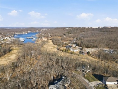 Nestled in the heart of the Village of Four Seasons, this on Seasons Ridge At Four Seasons in Missouri - for sale on GolfHomes.com, golf home, golf lot