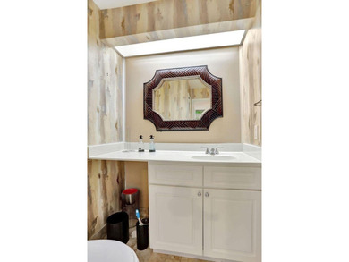 Turnkey + income-producing in sought-after Woodmont . This 3BD/2 on Woodmont Country Club in Florida - for sale on GolfHomes.com, golf home, golf lot