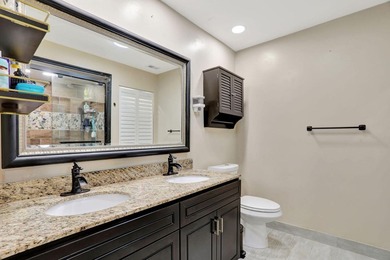 Turnkey + income-producing in sought-after Woodmont . This 3BD/2 on Woodmont Country Club in Florida - for sale on GolfHomes.com, golf home, golf lot