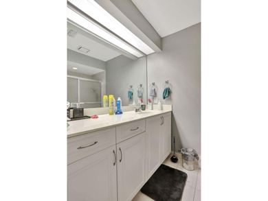 Turnkey + income-producing in sought-after Woodmont . This 3BD/2 on Woodmont Country Club in Florida - for sale on GolfHomes.com, golf home, golf lot