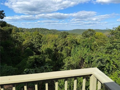 Enjoy stunning views of the Ozarks for miles from the back deck on Holiday Island Golf Course in Arkansas - for sale on GolfHomes.com, golf home, golf lot