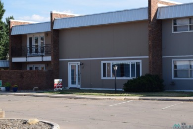 Welcome to this charming 2 bedroom, 2.5 bath brick condo on Chaparral Country Club in New Mexico - for sale on GolfHomes.com, golf home, golf lot