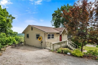 Enjoy stunning views of the Ozarks for miles from the back deck on Holiday Island Golf Course in Arkansas - for sale on GolfHomes.com, golf home, golf lot