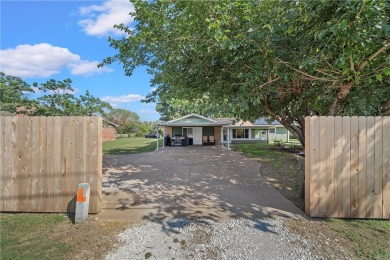 This large, family home sits just a stone's throw away from the on The Lake Country Club - Lake Waco in Texas - for sale on GolfHomes.com, golf home, golf lot