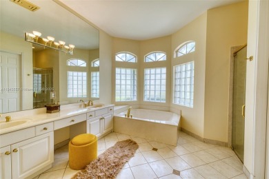 SPECTACULAR WATER VIEWS FROM 5 BED, 4 FULL BATH, POOL WITH on Heron Bay Golf Club in Florida - for sale on GolfHomes.com, golf home, golf lot