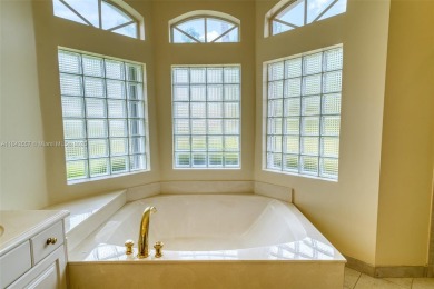SPECTACULAR WATER VIEWS FROM 5 BED, 4 FULL BATH, POOL WITH on Heron Bay Golf Club in Florida - for sale on GolfHomes.com, golf home, golf lot