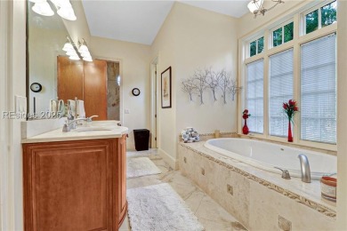 Welcome to a bright and inviting Lowcountry-style home in the on Long Cove Club in South Carolina - for sale on GolfHomes.com, golf home, golf lot