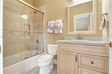 Welcome to a bright and inviting Lowcountry-style home in the on Long Cove Club in South Carolina - for sale on GolfHomes.com, golf home, golf lot
