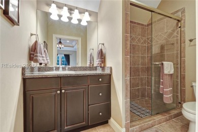 Welcome to a bright and inviting Lowcountry-style home in the on Long Cove Club in South Carolina - for sale on GolfHomes.com, golf home, golf lot
