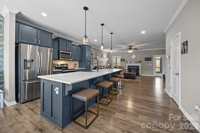 Set in Tillery Tradition, this home offers a relaxed, active on The Tillery Tradition Country Club in North Carolina - for sale on GolfHomes.com, golf home, golf lot