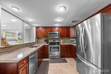 Public: Discover easy one-level living in this charming end unit on Clearbrook Golf Club in New Jersey - for sale on GolfHomes.com, golf home, golf lot