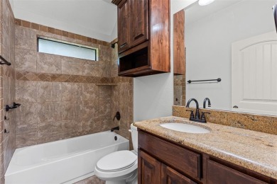 Welcome to this stunning brick and stone home located in the on Pecan Plantation Country Club in Texas - for sale on GolfHomes.com, golf home, golf lot