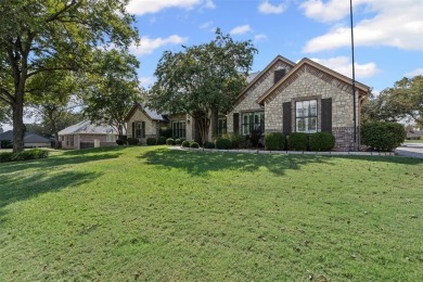 Welcome to this stunning brick and stone home located in the on Pecan Plantation Country Club in Texas - for sale on GolfHomes.com, golf home, golf lot