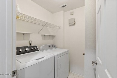 Top-Floor Condo with Golf Views | 8 Minutes to the Beach | Dual on Windsor Parke Golf Club in Florida - for sale on GolfHomes.com, golf home, golf lot