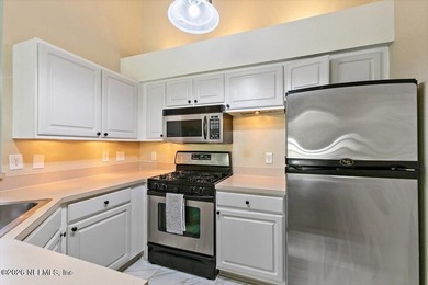 Top-Floor Condo with Golf Views | 8 Minutes to the Beach | Dual on Windsor Parke Golf Club in Florida - for sale on GolfHomes.com, golf home, golf lot