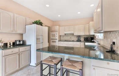 Situated on a prime lot in the exclusive Orchards Golf Course on The Orchards Golf Club in Michigan - for sale on GolfHomes.com, golf home, golf lot
