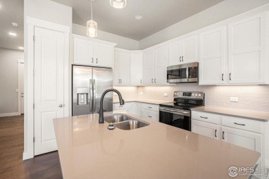 Welcome to this beautiful 3-bedroom, 3.5-bath end-unit townhome on Highland Meadows Golf Course in Colorado - for sale on GolfHomes.com, golf home, golf lot