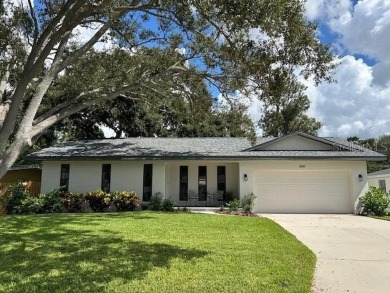 Experience the best of Dunedin living in this meticulously on The Dunedin Country Club in Florida - for sale on GolfHomes.com, golf home, golf lot