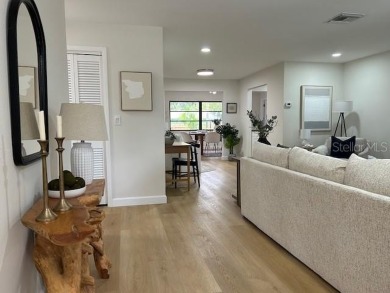 Experience the best of Dunedin living in this meticulously on The Dunedin Country Club in Florida - for sale on GolfHomes.com, golf home, golf lot