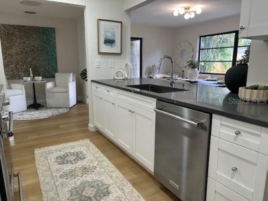 Experience the best of Dunedin living in this meticulously on The Dunedin Country Club in Florida - for sale on GolfHomes.com, golf home, golf lot