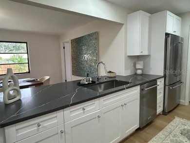 Experience the best of Dunedin living in this meticulously on The Dunedin Country Club in Florida - for sale on GolfHomes.com, golf home, golf lot