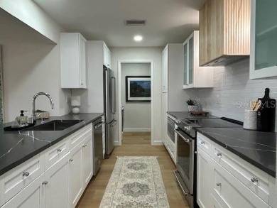 Experience the best of Dunedin living in this meticulously on The Dunedin Country Club in Florida - for sale on GolfHomes.com, golf home, golf lot