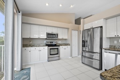 Soak in serene lake views with a backdrop of the golf course in on Santa Lucia River Club in Florida - for sale on GolfHomes.com, golf home, golf lot