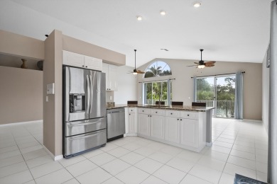 Soak in serene lake views with a backdrop of the golf course in on Santa Lucia River Club in Florida - for sale on GolfHomes.com, golf home, golf lot