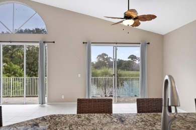 Soak in serene lake views with a backdrop of the golf course in on Santa Lucia River Club in Florida - for sale on GolfHomes.com, golf home, golf lot