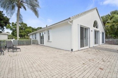 Soak in serene lake views with a backdrop of the golf course in on Santa Lucia River Club in Florida - for sale on GolfHomes.com, golf home, golf lot