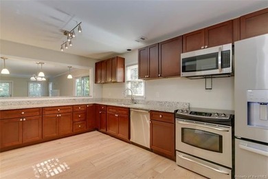 Welcome to this inviting 3-bedroom, 2.5-bath end-unit townhome on Kingsmill Resort and Golf Club in Virginia - for sale on GolfHomes.com, golf home, golf lot