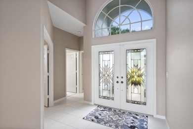 Soak in serene lake views with a backdrop of the golf course in on Santa Lucia River Club in Florida - for sale on GolfHomes.com, golf home, golf lot