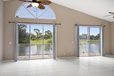 Soak in serene lake views with a backdrop of the golf course in on Santa Lucia River Club in Florida - for sale on GolfHomes.com, golf home, golf lot