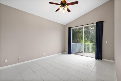 Soak in serene lake views with a backdrop of the golf course in on Santa Lucia River Club in Florida - for sale on GolfHomes.com, golf home, golf lot