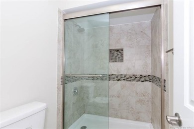 Welcome to this inviting 3-bedroom, 2.5-bath end-unit townhome on Kingsmill Resort and Golf Club in Virginia - for sale on GolfHomes.com, golf home, golf lot