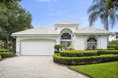 Soak in serene lake views with a backdrop of the golf course in on Santa Lucia River Club in Florida - for sale on GolfHomes.com, golf home, golf lot